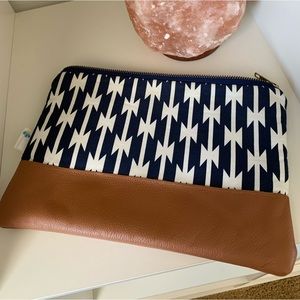 Navy and white patterned clutch with vegan leather